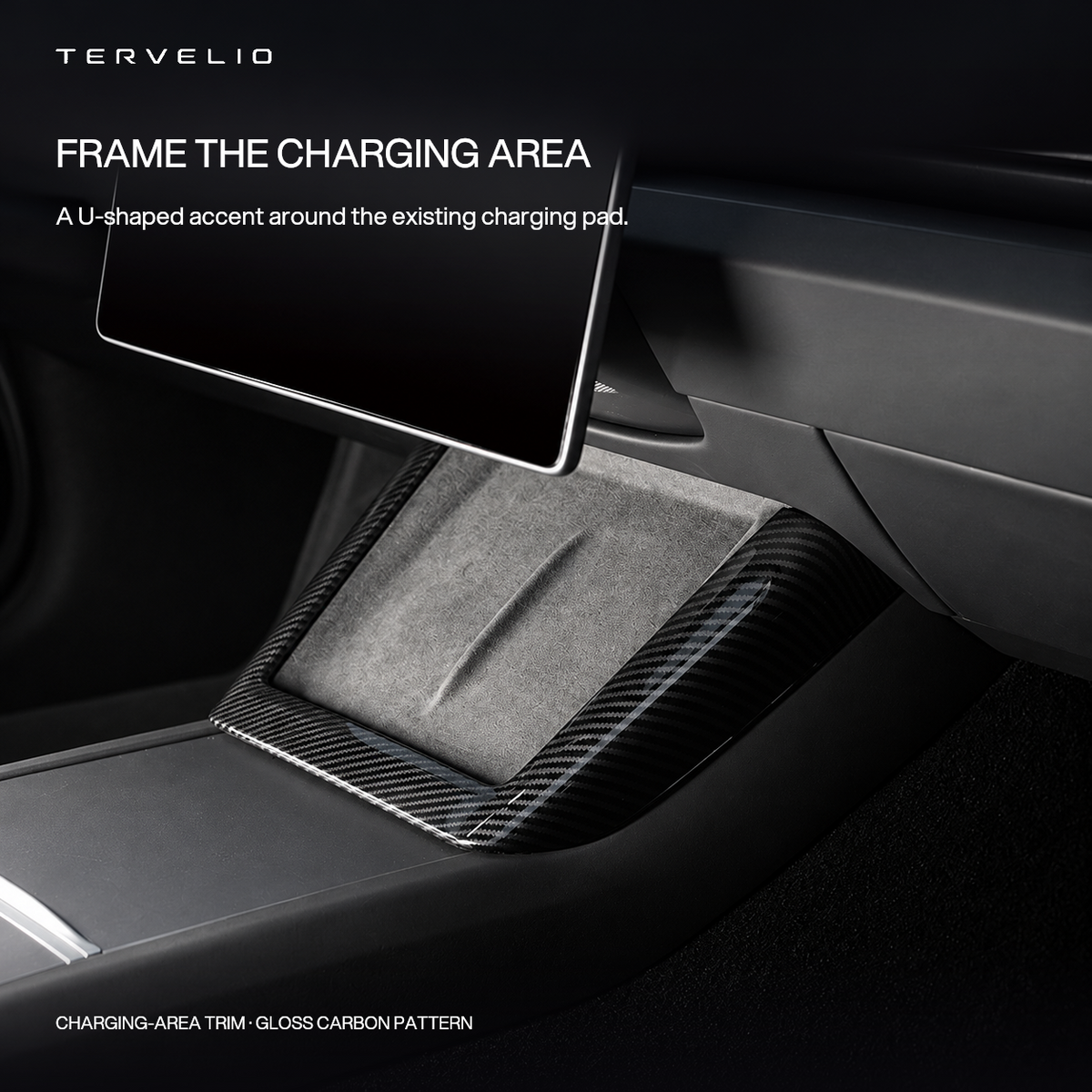 Gloss carbon-pattern U-shaped trim fitted around the original center-console charging pad.