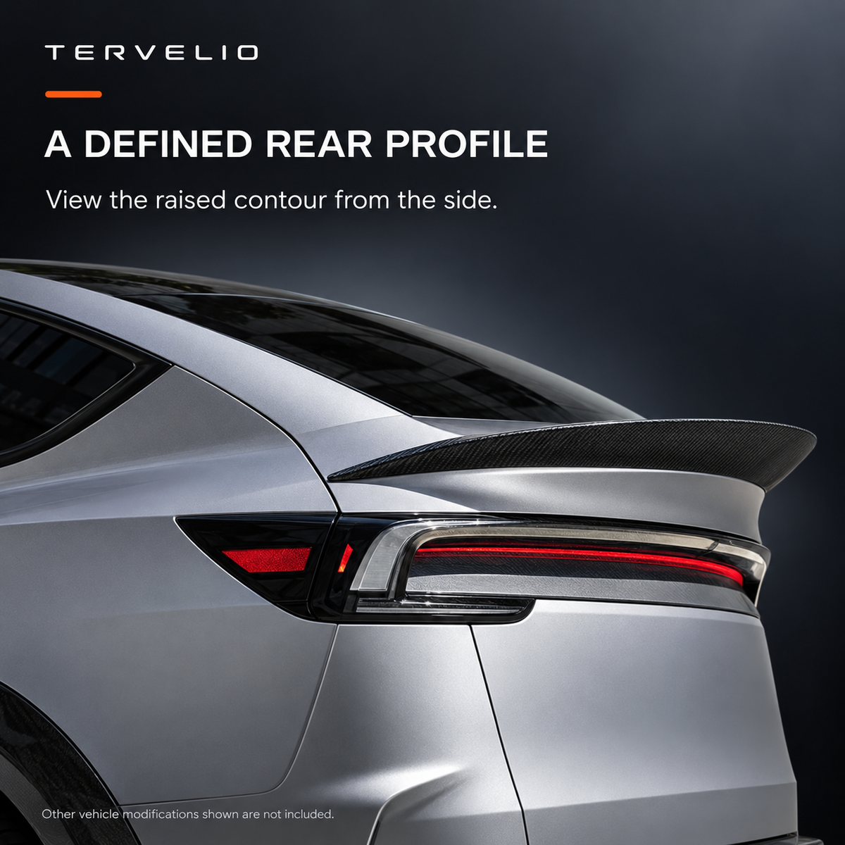 Rear three-quarter profile of the photographed spoiler on a modified gray refreshed Model Y.