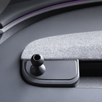 Dashboard phone-mount base and ball joint beside grey woven trim