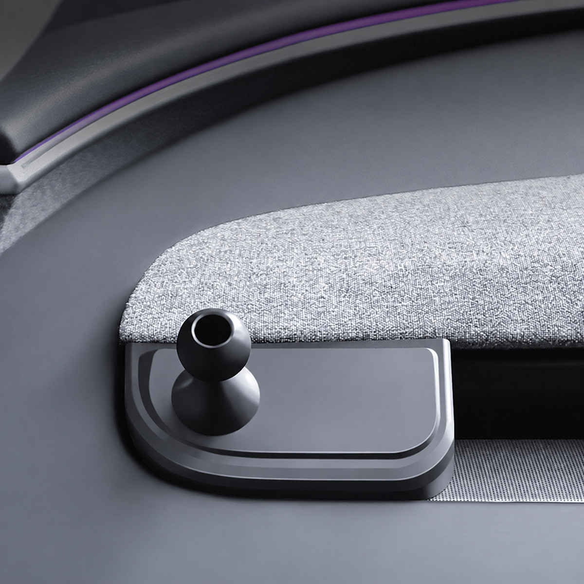 Dashboard phone-mount base and ball joint beside grey woven trim