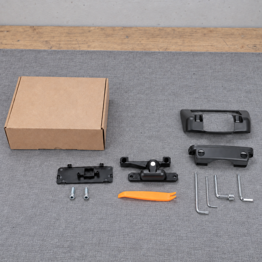 Display mount kit and plain packaging laid out on a grey work mat