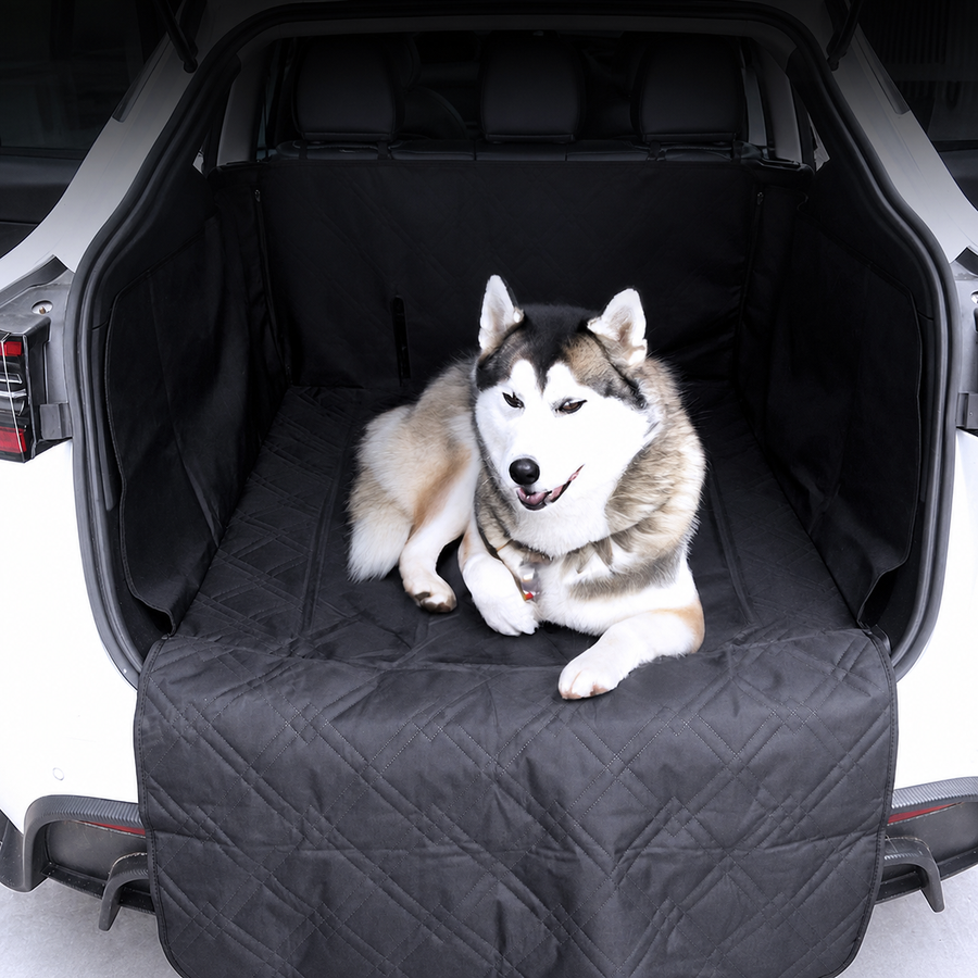 Dog resting on a quilted cargo liner with the rear hatch open
