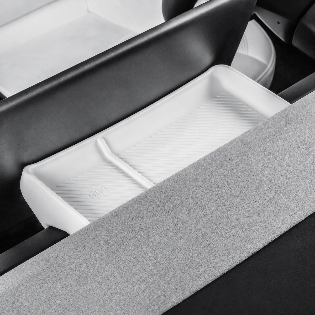 One white divided silicone tray shown in place beside the original console surfaces.