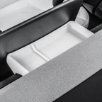 A white divided silicone tray shown in its console position beside the original interior surfaces.