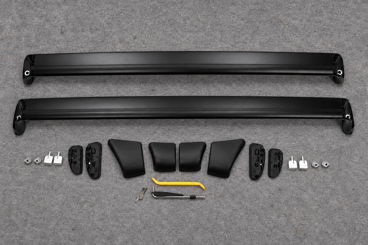 Two unassembled roof rack crossbars and their components on a grey inspection mat