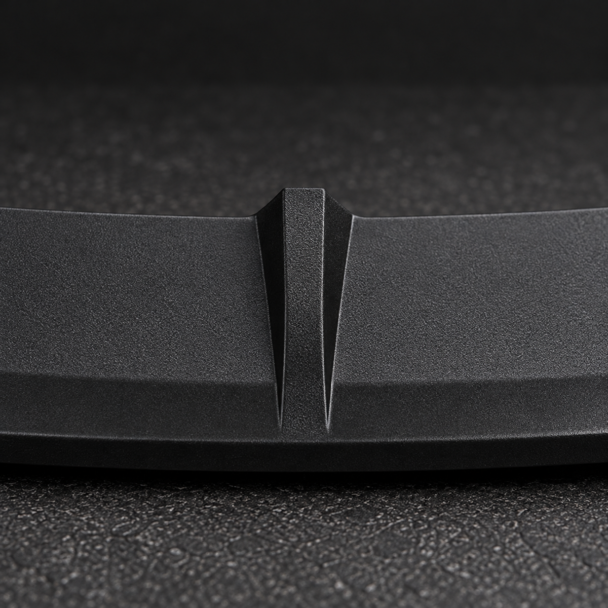 Close detail of the fine-grain matte ABS surface and center rib