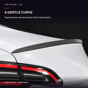 Tapered spoiler end following the curved rear hatch corner