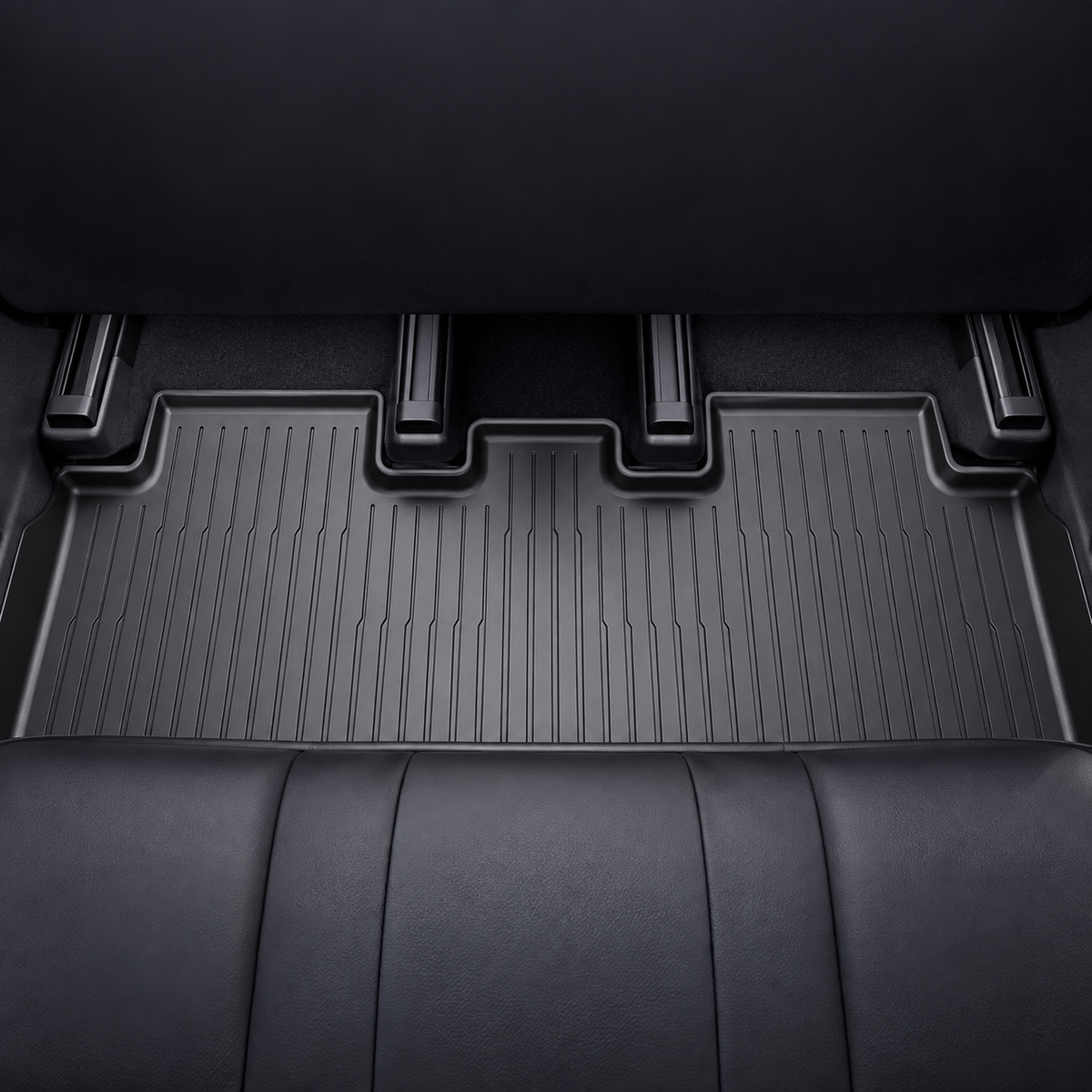 Supplier installation reference showing a wide black rear cabin floor mat and its stepped seat-rail outline. AI-assisted cleanup.