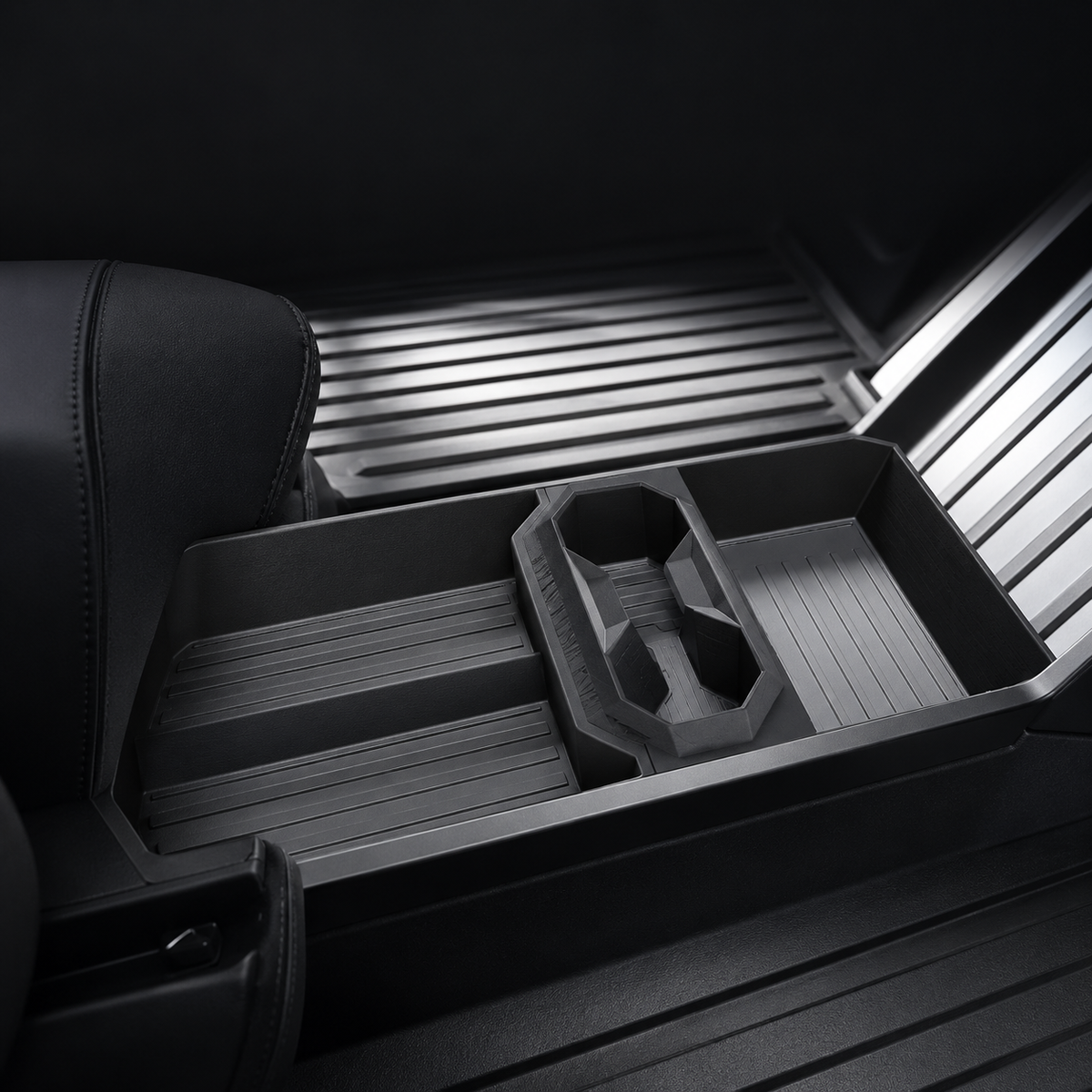 Cup-holder configuration installed in the Cybertruck lower-console space; text-free detail image