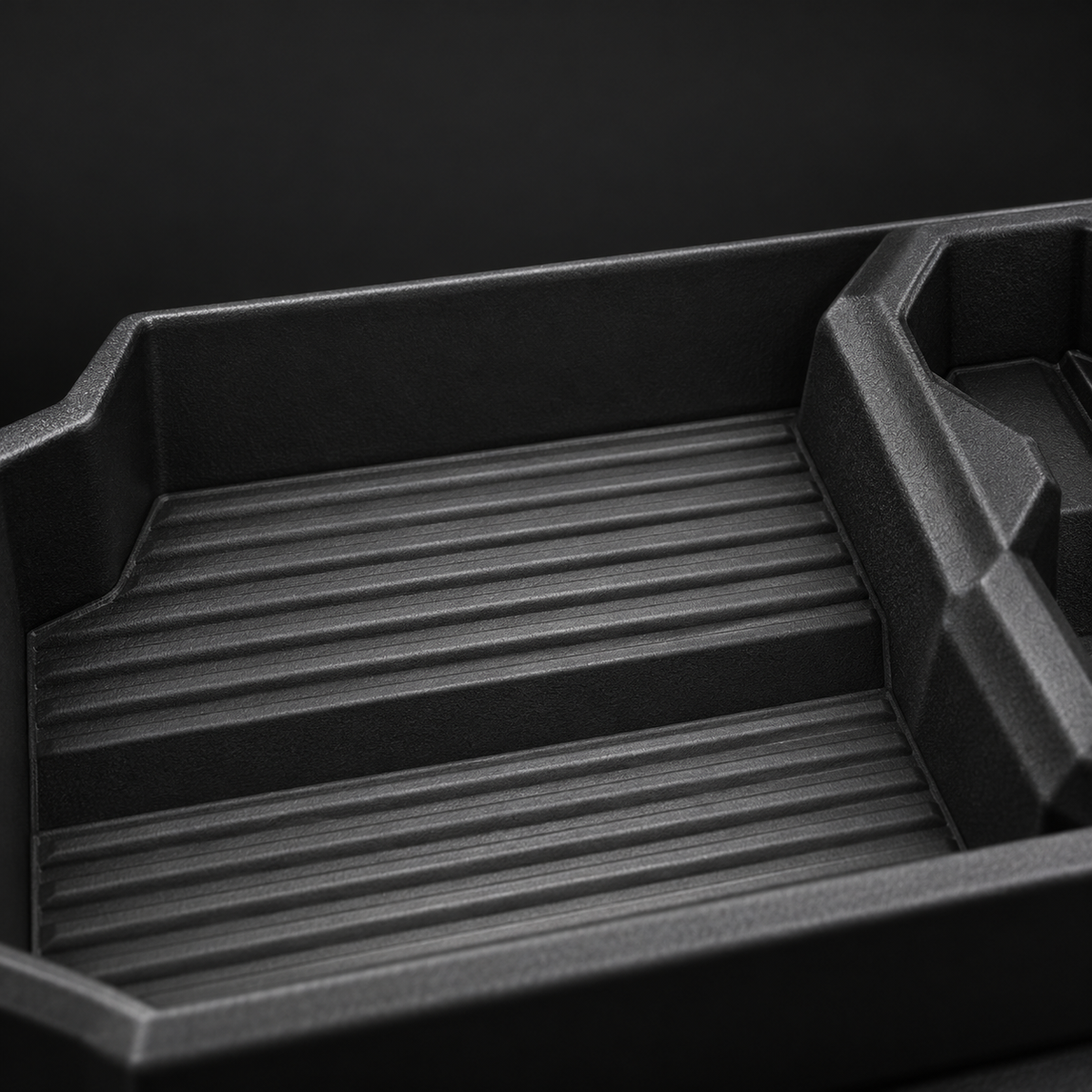 Ribbed liner and perimeter detail in the Cybertruck cup-holder configuration; text-free detail image