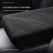 Close-up of the suede surface and rounded edge of an armrest lid cover.