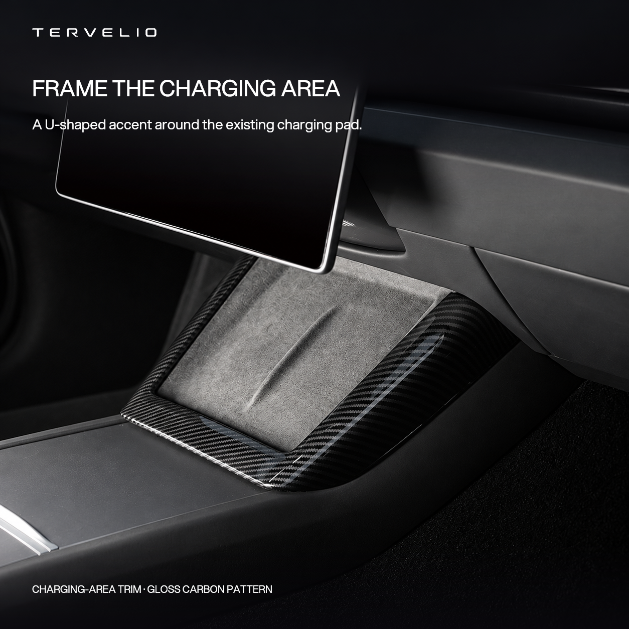 Gloss carbon-pattern U-shaped trim fitted around the original center-console charging pad.