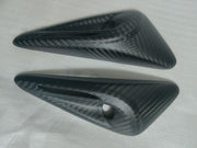 Full-wrap camera trim cover close-up showing the carbon-style finish and camera opening