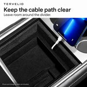 Cable clearance example showing a lead beside the organizer partition, away from moving console edges.