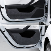 Suede door kick protector panels installed on the front and rear doors