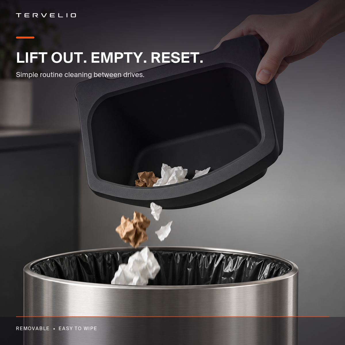 Removable rear console waste bin shown open for cleaning