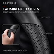 Smooth upper surface and perforated side-panel detail of the black steering wheel cover.