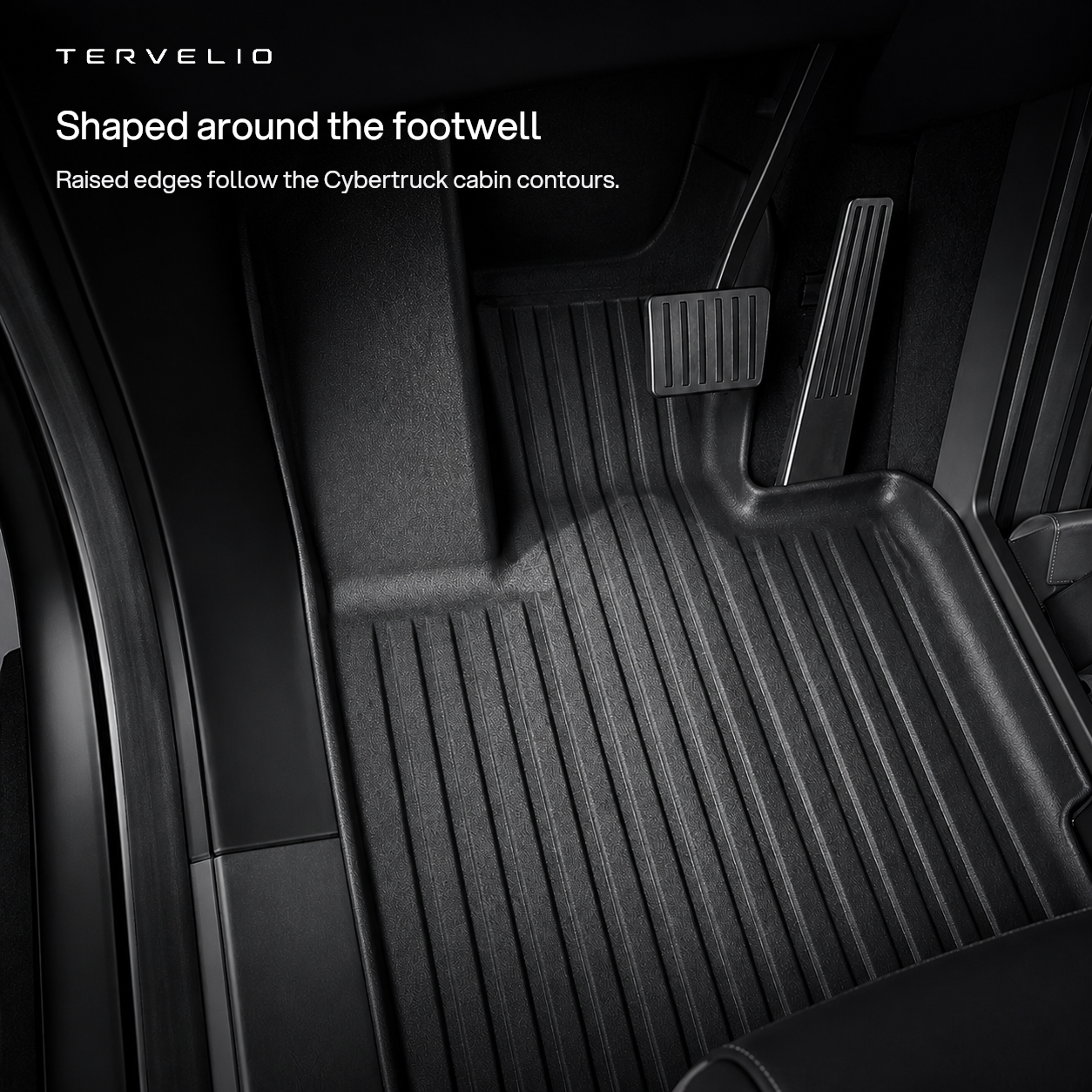Shaped around the footwell. Raised edges follow the Cybertruck cabin contours.