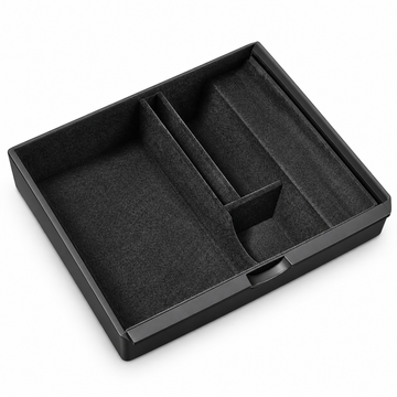 Black flocked console tray with divided compartments, shown on white.