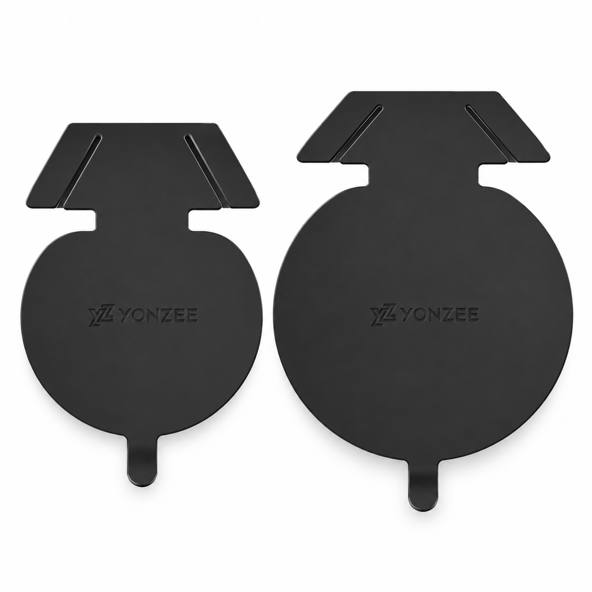 Supplier-photographed pair of black TPU charge-port covers on a white background, showing their circular bodies and pull tabs.