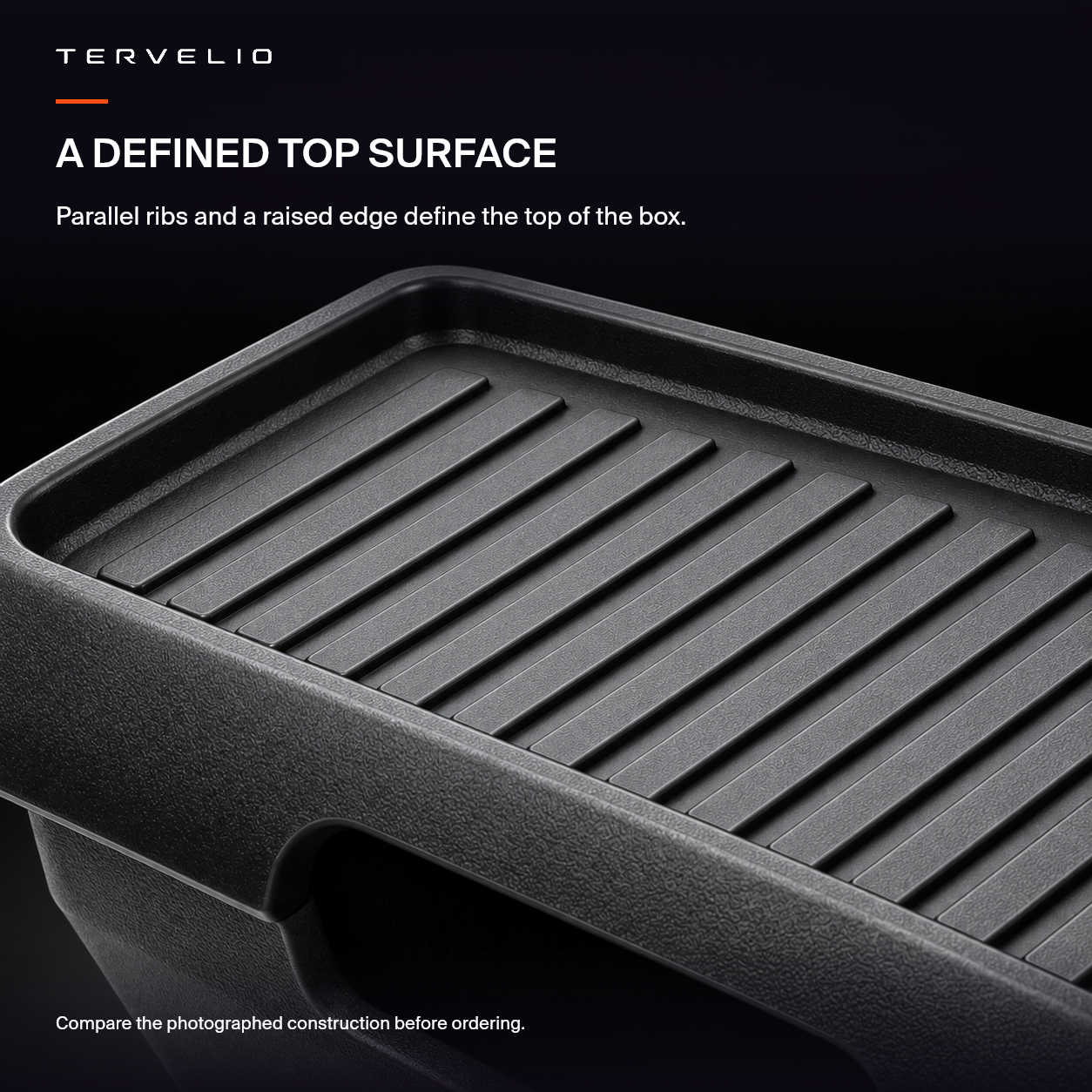 Black rear-console storage box — slatted top, English feature illustration