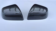 TERVELIO carbon-style side mirror cover pair, oblique exterior view of both shell shapes.