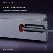 Close-up of the grey fascia, orange-red cable exit and dark recessed cable holder.