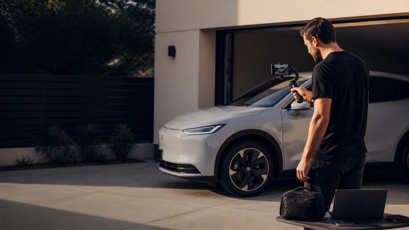 Independent automotive creator filming an electric vehicle walk-around